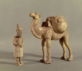Funerary statuettes of a laden camel and a barbarian caravanner, Tang Dynasty (618-907)